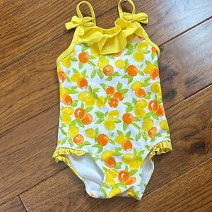 Yellow and Orange Fruit Print Swimsuit
Janie and Jack Pink Label.
